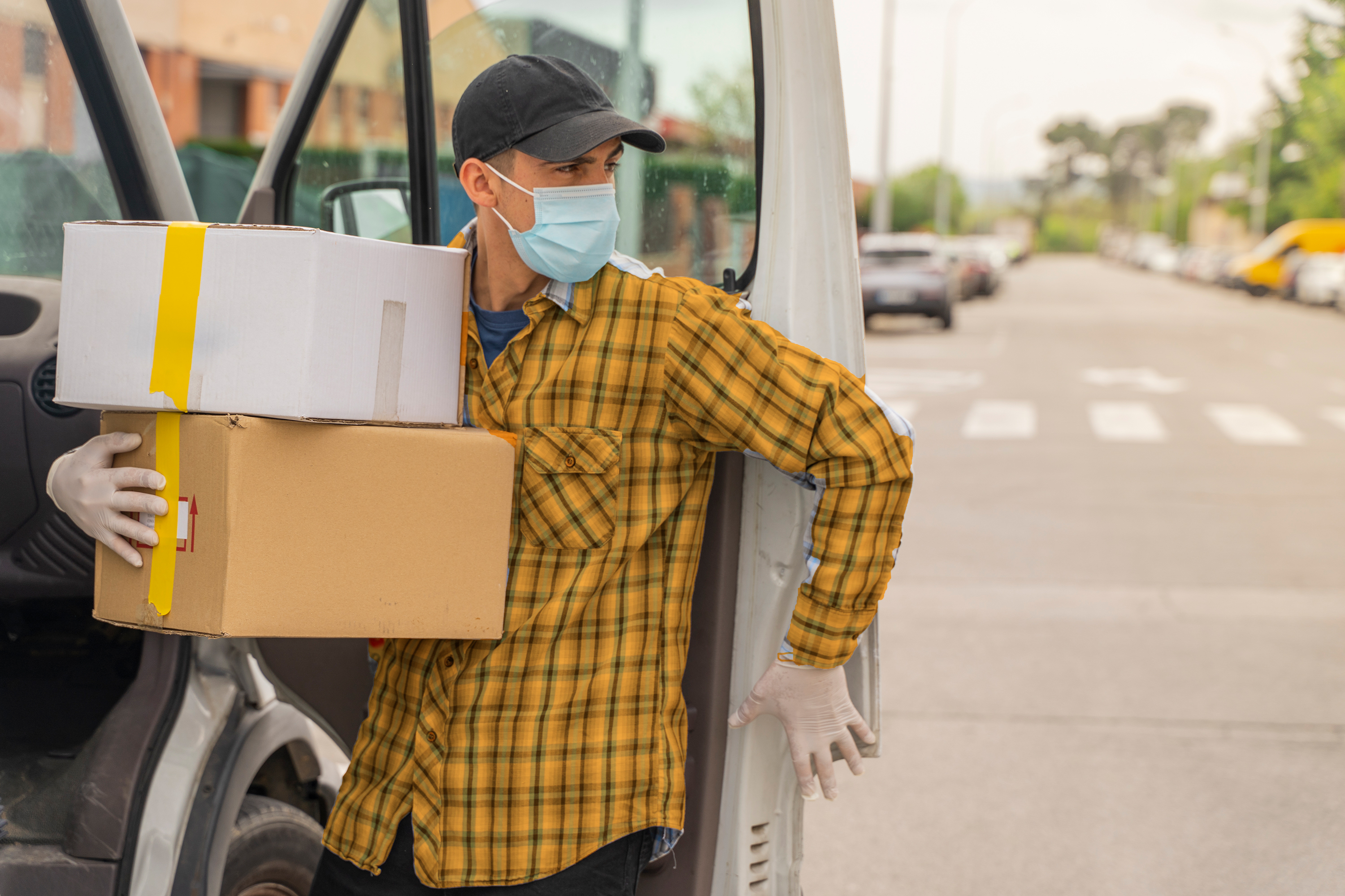 a delivery man unloading packages from a van